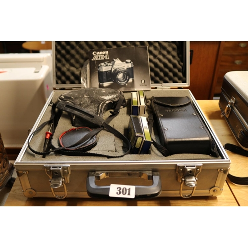 Canon AE1 cased with Tamron Lens