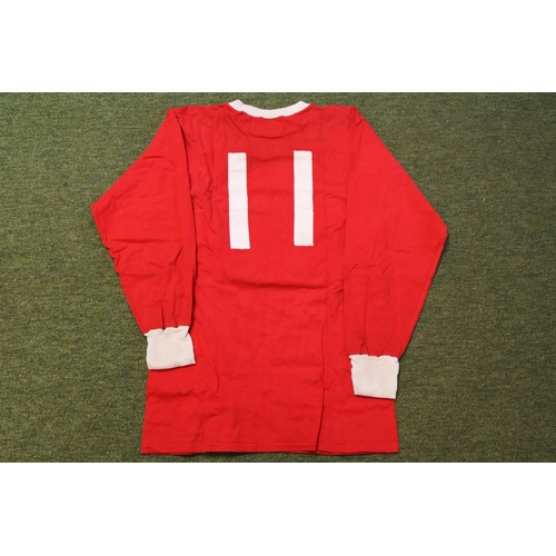 GEORGE BEST 1967/68 MATCH WORN #11 MANCHESTER UNITED HOME JERSEY WITH MEMORABILIA - This incredible lot includes the following items: (1) A George Best 1967/68 Match Worn #11 Manchester United Home jersey. In the 1967/68 season Best was at his peak in Old Trafford during which he was voted  as the Ballon d'Or winner in that year. The jersey is still in good condition for its age. This garment was originally obtained via a Sportsmen’s Dinner in the Greater Manchester area attended by MUFC squad members, and remained in a private collection for decades. The item will come presented in a lovely black gift box for future safe-keeping. The jersey comes with a certificate of authenticity. (2) A pair of red Umbro shorts used by George Best in a training session in the 1970/71 season, see accompanying photo. (3) A September 18th 1971 match programme of the Manchester United v West Ham United match. The programme is signed by George Best and he inscribed it by "3" denoting the hat-trick he scored in that match! (4) A 15th January 1972 match programme of the Manchester United v Southampton match. (5) A 1st January 1974 match programme of Manchester United v Queens Park Rangers match. This was Best's last match with the United club. (6) A pair of two tickets for the Manchester United v Benfica final match of the European Cup that was held on May 29th, 1968. (7) A 3rd April 2002 Conferment of the Honorary Freedom of the Borough on George Best medal in its jewel case together with its accompanying booklet.