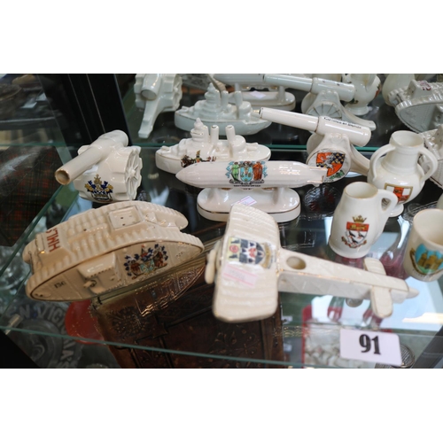 91 - Collection of assorted Goss, Willow art and other Crested China to include Tanks, Zeppelin, Cannon e... 