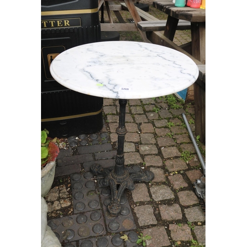 588 - Circular Marble topped table with Cast iron base