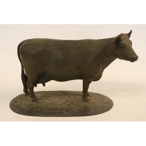 87 - Early 20thC School Bronze Model of a Cow on oval base marked W M Chance. 24cm in Length