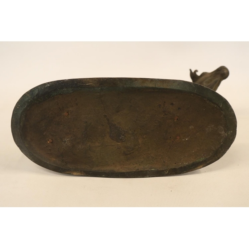 87 - Early 20thC School Bronze Model of a Cow on oval base marked W M Chance. 24cm in Length