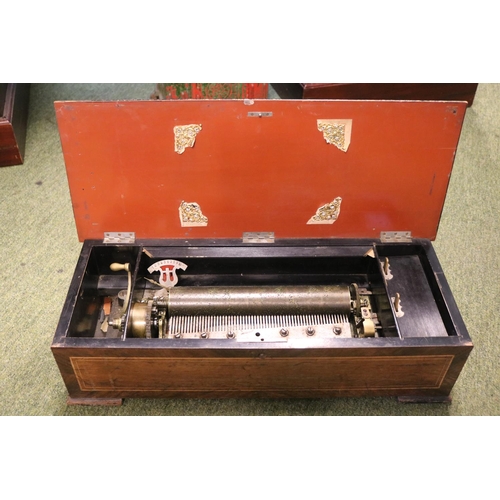 98 - 19thC Inlaid Swiss Cylinder Music box of six Airs in need of restoration. 59cm in Length