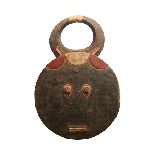 128 - Ivory Coast Baule Goli Mask of circular design with rectangular diminutive mouth and large horns. 98... 