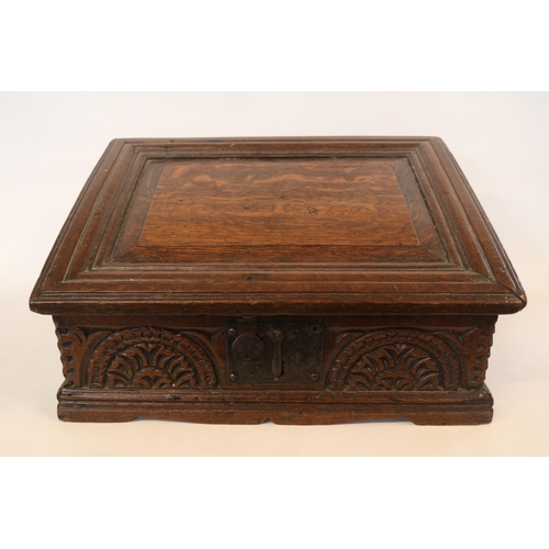 178 - A Georgian oak bible box, early 18th century, the sloped hinged lid above floral guilloche carved fr... 