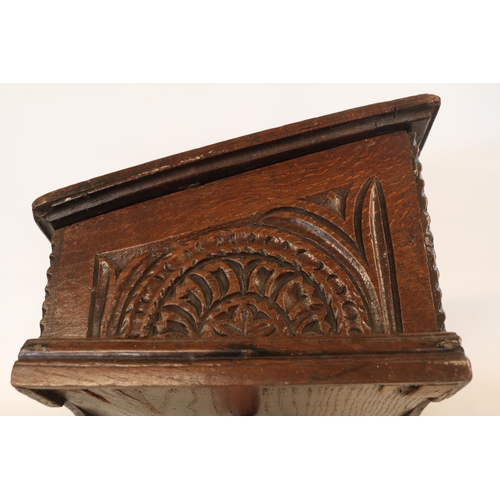 178 - A Georgian oak bible box, early 18th century, the sloped hinged lid above floral guilloche carved fr... 