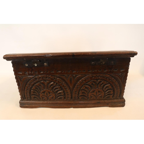 178 - A Georgian oak bible box, early 18th century, the sloped hinged lid above floral guilloche carved fr... 