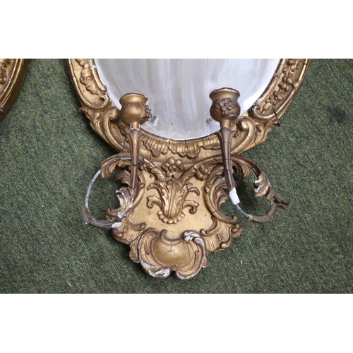 183 - Pair of Gilt Gesso George III Wall mirrors with candle holders, shaped bevelled mirror and foliate g... 