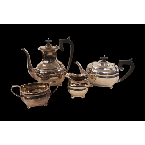 298 - 4 Piece Edwardian Silver Tea set with ebony handles and knops of panelled form supported on ball fee... 