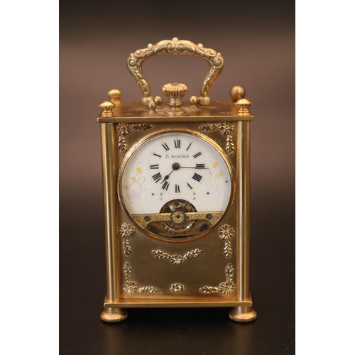 317 - Edwardian gilded travelling clock fitted with 8 Day Hebdomas 8 day movement. The Case embossed with ... 