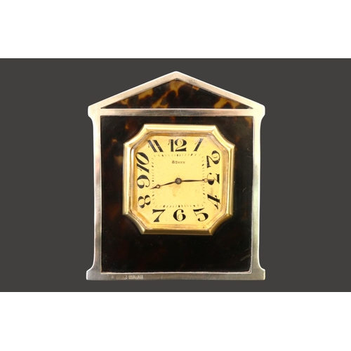 318 - Tortoiseshell Silver mounted 8 Day easel clock with numeral dial Hallmarked London 1924. 10cm in Hei... 