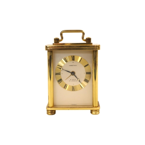 331 - Tiffany & Co 8 Day 15 Jewels carriage clock of diminutive size with roman numeral dial. 90mm in Heig... 