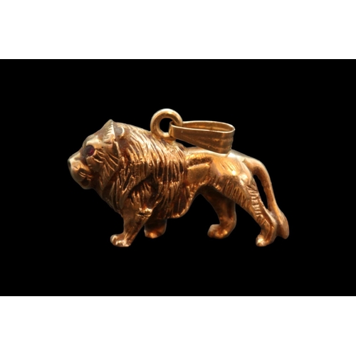 352 - Heavy 9ct Gold Lion Pendant with  Rose Cut Ruby eyes and hanging bale. Stamped 375 Hallmark to base.... 