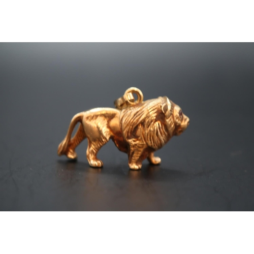 352 - Heavy 9ct Gold Lion Pendant with  Rose Cut Ruby eyes and hanging bale. Stamped 375 Hallmark to base.... 