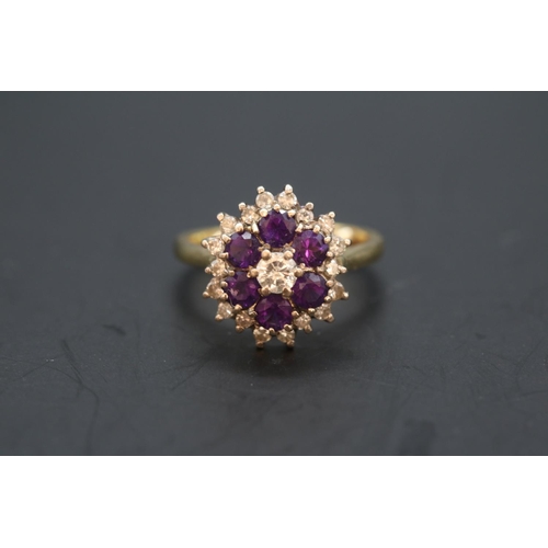 353 - Ladies 18ct Gold Amethyst and Diamond Cluster ring. Central Diamond estimated 0.25ct (4.4mm) Brillia... 