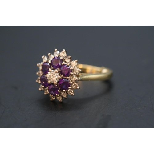 353 - Ladies 18ct Gold Amethyst and Diamond Cluster ring. Central Diamond estimated 0.25ct (4.4mm) Brillia... 