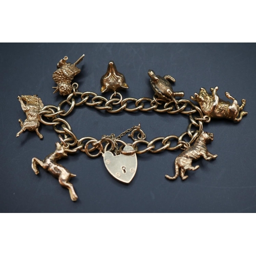 355 - Early 20thC 9ct Gold Charm bracelet comprising of Seven charms to include Tiger, Bull, Turtle, Fox, ... 