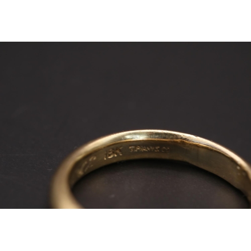 360 - 18ct Gold Tiffany & Co Court Shaped wedding band with inscription to interior. Size M, 4.4g total we... 