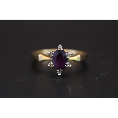 390 - Ladies 18ct Oval Amethyst and Diamond set ring Size L. 3.5g total weight