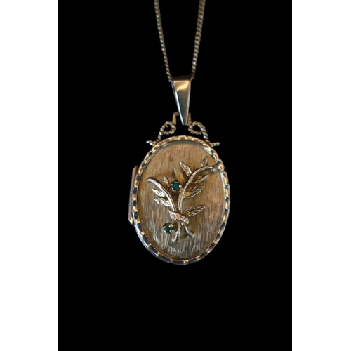 398 - 9ct Gold Emerald set Floral Oval Locket with hoop mount and 9ct gold chain 42cm in Length. 9.3g tota... 