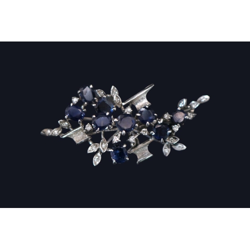 400 - 18ct White Gold 1970s Style Sapphire and Diamond set Floral spray brooch. 50mm x 30mm. 9.1gtotal wei... 