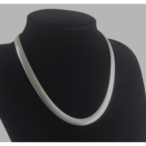 404 - Solid silver herringbone design necklace 8mm wide, weighs 43.4gms with lobster clasp.