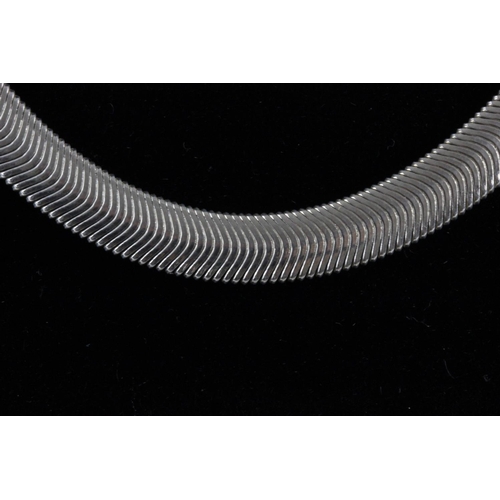 404 - Solid silver herringbone design necklace 8mm wide, weighs 43.4gms with lobster clasp.