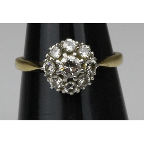 406 - 18ct Gold & Platinum Nine Diamond Set Ring Est 1.00CT. A simply stunning 18ct gold & platinum 9 diam... 