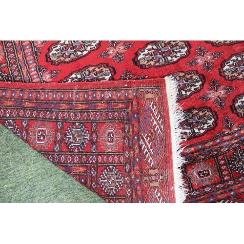 349 - Large Red Bokhara Rug with Tassel ends 197cm in Length