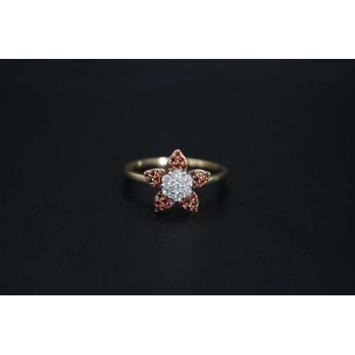 Ladies 10K Gold Diamond Diamond Cluster set ring in the form of a Flower 0.50ct total estimated weight. Size N. 2.16g total weight with valuation for £1200