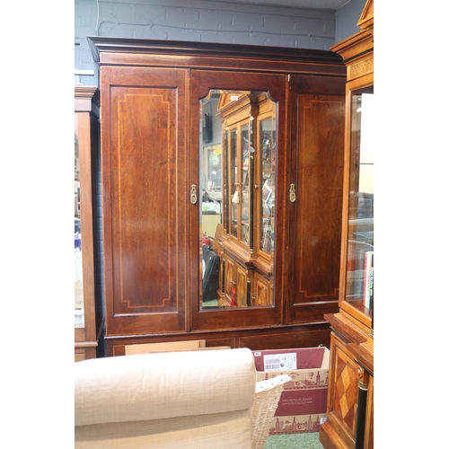 534 - Edwardian Mahogany Wardrobes Triple Wardrobe with mirror to door and brass drop handles and drawer t... 