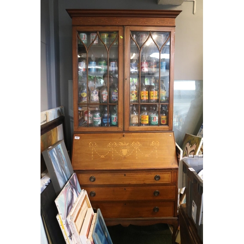 552 - Large glazed 19th century bureau bookcase with traditional inlay work.