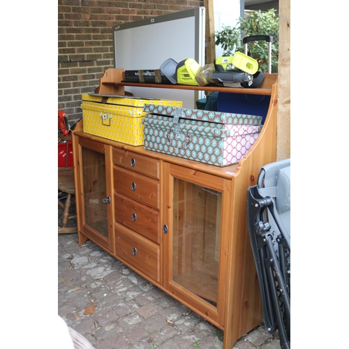 584 - Pine kitchen unit with glazed roors and drawers to centre