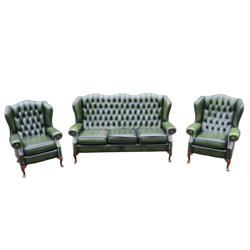 418 - Green Leather Chesterfield Wing arm sofa suite comprising of 3 seater sofa and matching armchairs on... 