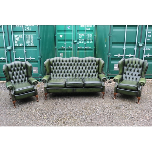 418 - Green Leather Chesterfield Wing arm sofa suite comprising of 3 seater sofa and matching armchairs on... 