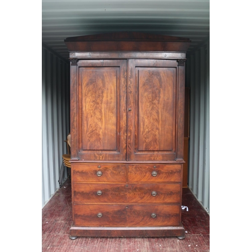 422 - William IV Flame Mahogany fronted Linen press with panelled doors over 4 drawers with brass escutche... 