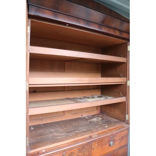 422 - William IV Flame Mahogany fronted Linen press with panelled doors over 4 drawers with brass escutche... 