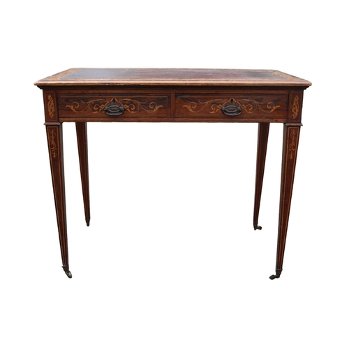 424 - Edwardian Rosewood veneered two drawer desk on tapering legs and brass caster feet. 89cm in Width