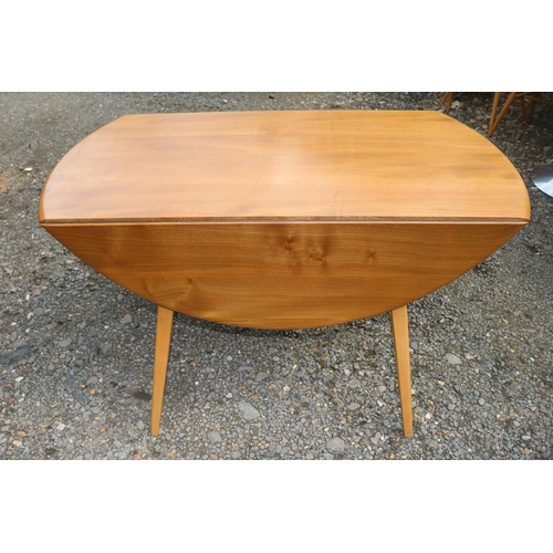 432 - Ercol Blonde Elm Dropleaf Oval dining table on splayed legs. 124cm in Length