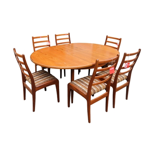 438 - G-Plan Mid Century Oval dining table with cantilever leaf and 6 Matching Chairs with paper labels. 1... 