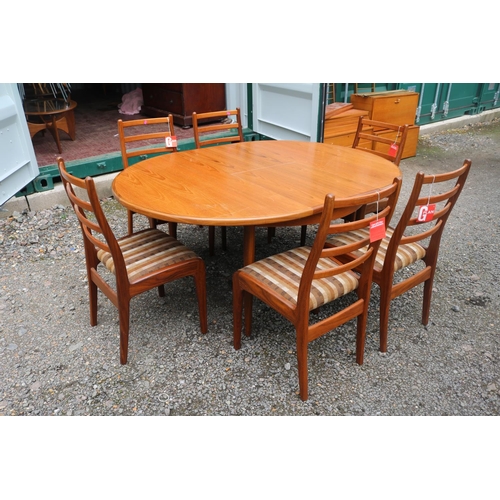 438 - G-Plan Mid Century Oval dining table with cantilever leaf and 6 Matching Chairs with paper labels. 1... 