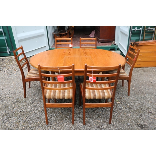 438 - G-Plan Mid Century Oval dining table with cantilever leaf and 6 Matching Chairs with paper labels. 1... 