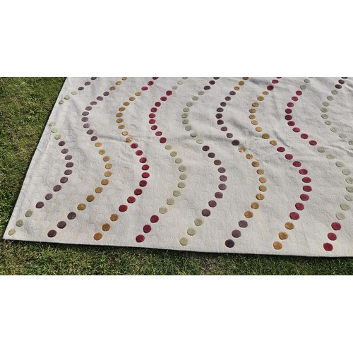 447 - William Yeoward for the Rug Company. 'Madelaine' Wool rug with circular geometric to Beige ground 30... 