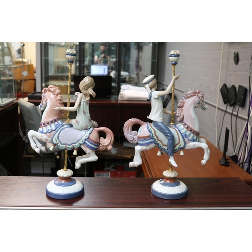 146 - Lladro Carousel Horses 1469 & 1470 Boy and Girl Retired 2000. Sculpted by Jose Puche. 39cm in Height