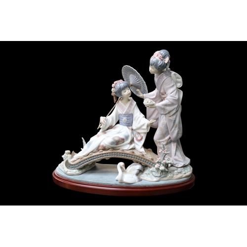 147 - Lladro Springtime in Japan Retired in 2019 No 1445, Sculpted by Salvador Debon. 32 x 35cm inc plinth... 