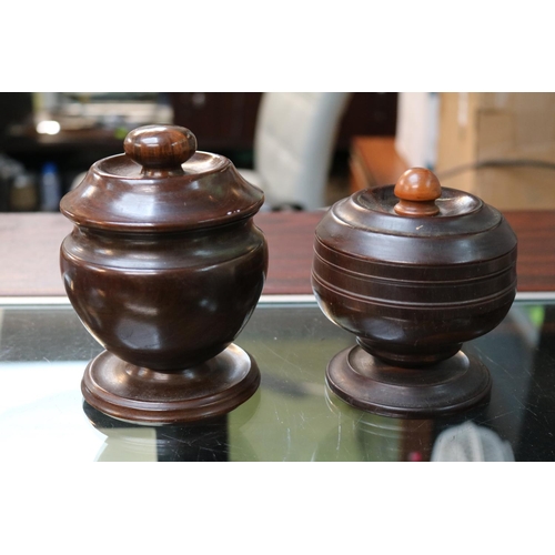 111 - 2 Turned Treen Hardwood lidded jars. 14cm in Height