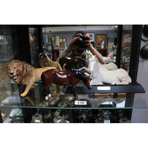 156 - Beswick figure of Lion, Beswick Horse and 'Spirit of Peace' on wooden plinth