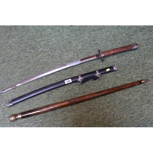 167 - Reproduction Samurai Sword in scabbard and a Carved wooden stick with brass ferrule