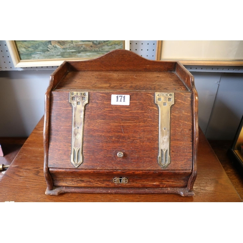 171 - Oak Arts & Crafts style stationary box with brass metal hinges over single drawer. 32cm in Diameter