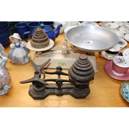 220 - Cast Iron Beatrice 7lb weighing scales and another set of scales with weights